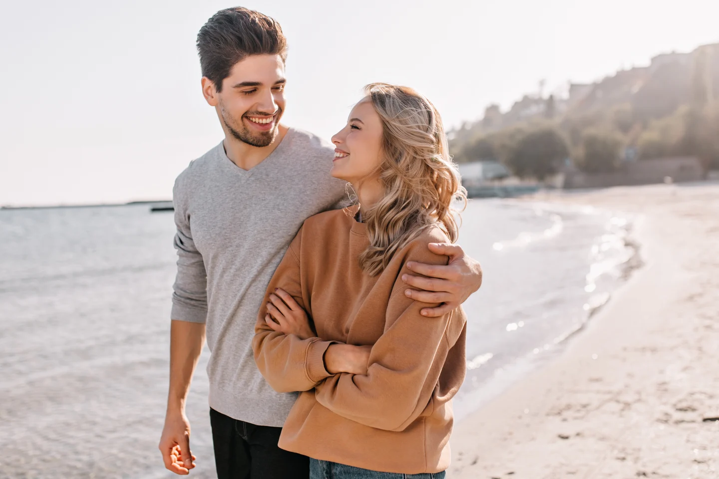 Couple enjoying a relaxed connection together by the sea