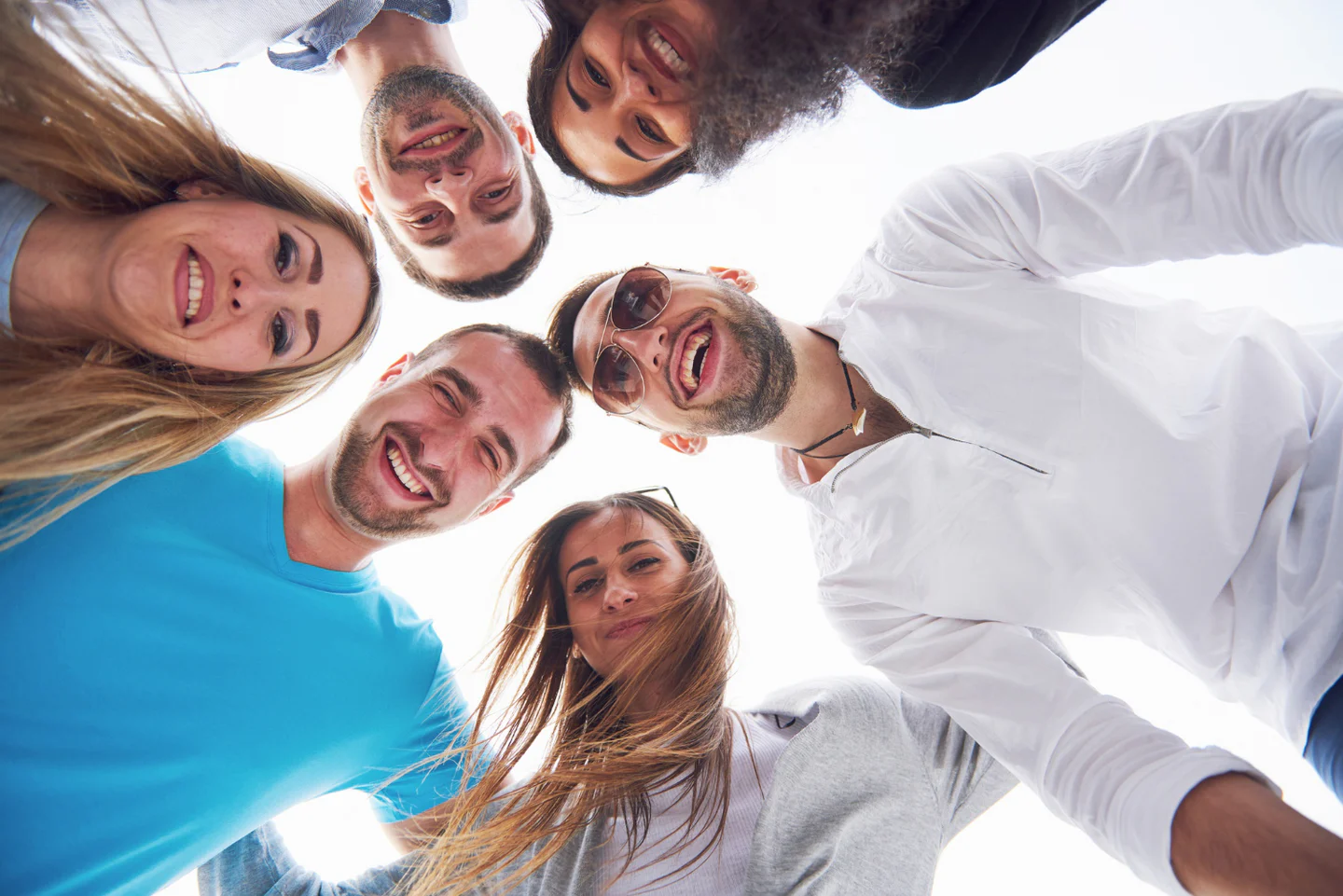 Diverse group of friends smiling together outdoors