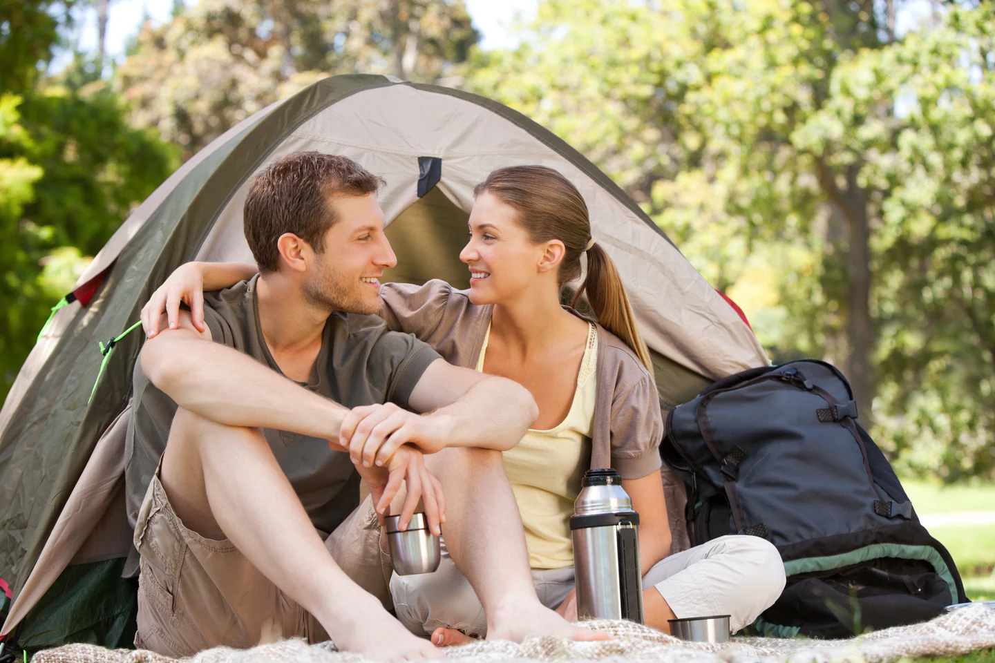 Couple enjoying time together while camping in a park